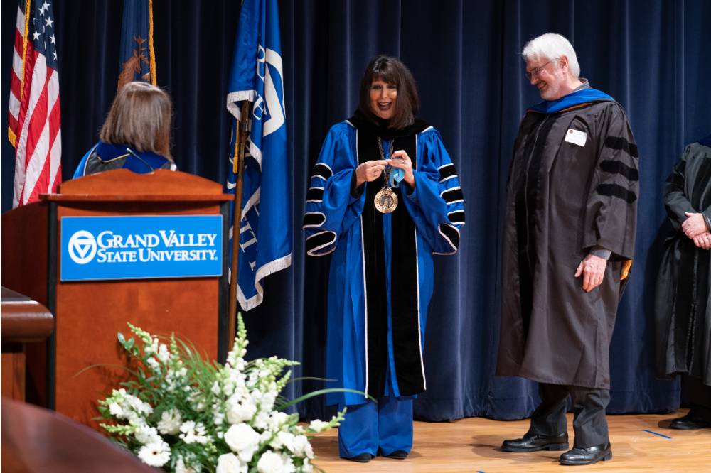 Provost, President and award recipient on stage